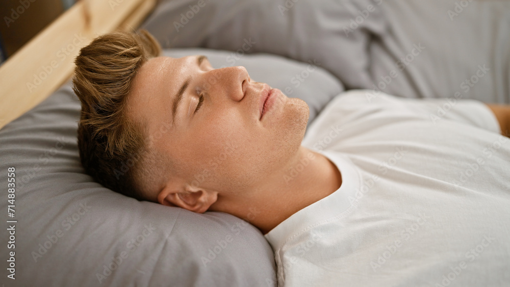 Young caucasian man lying on bed sleeping at bedroom