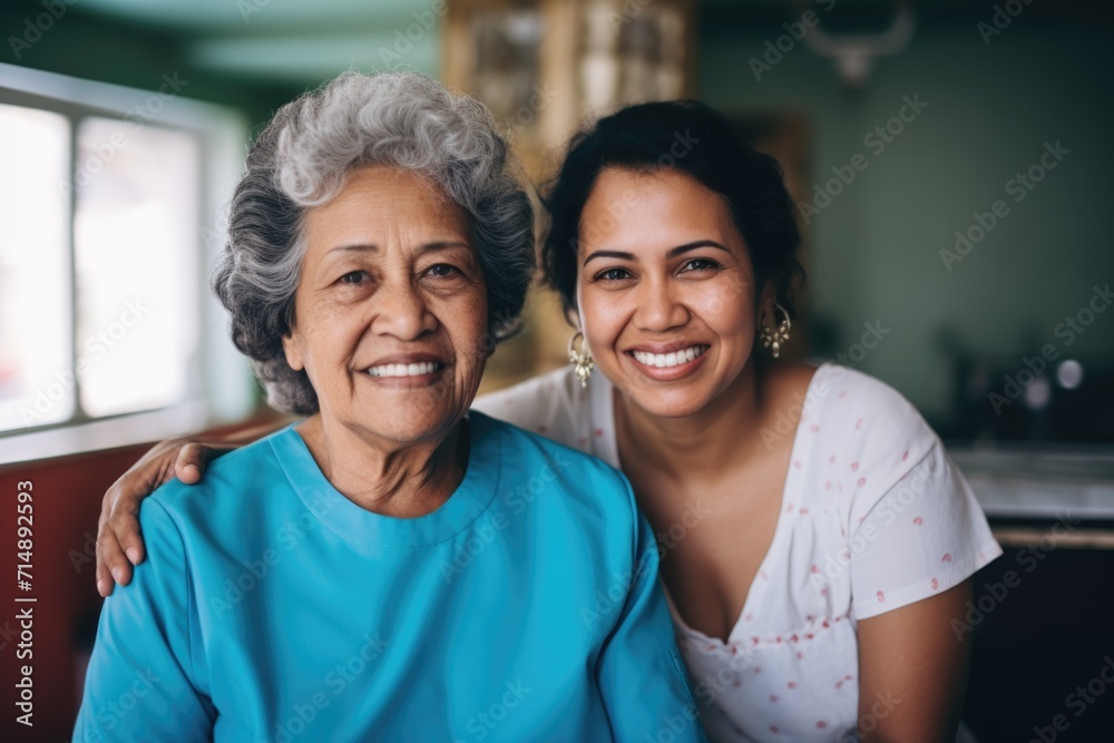 Portrait of a young female caregiver with senior patient at home Portrait of a young female caregiver with senior patient at home