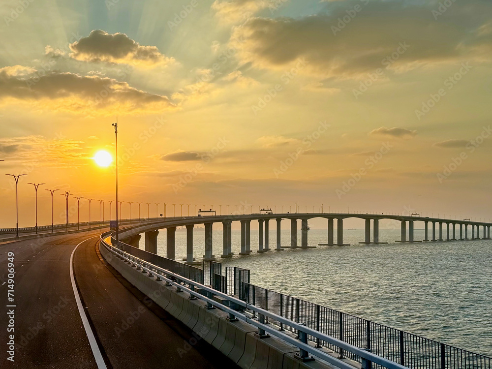 Obraz premium the famous Hong kong-Zhuhai-Macau Brdige or HZMB, the longest bridge in the world spanning accross 50 km above and under the ocean. Taken during beautiful sunset.
