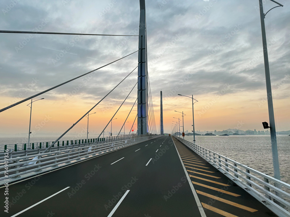 the famous Hong kong-Zhuhai-Macau Brdige or HZMB, the longest bridge in the world spanning accross 50 km above and under the ocean. Taken during beautiful sunset.