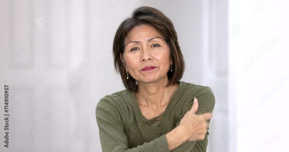 Portrait attractive woman enjoying posing looking at camera smiling hands through hair relaxing standing studio light. Portrait attractive woman enjoying posing looking at camera smiling hands through hair relaxing standing studio light.