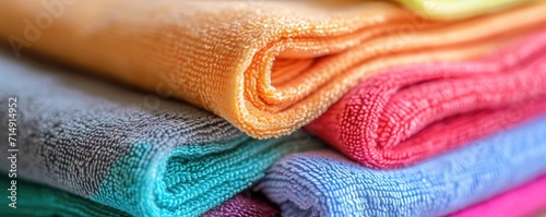 Closeup of heap of multicolored microfiber cleaning clothes. Background of rags. Household supplies. Spring cleaning, housework and hygiene concept. Minimalistic design for banner, poster