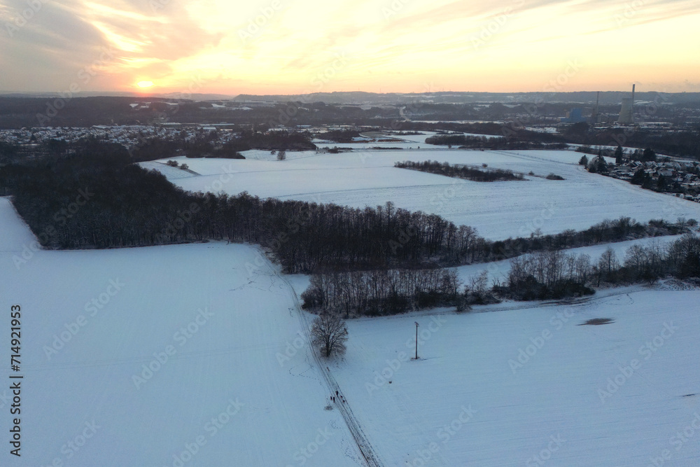 Winter Sunset over Snowy Landscape