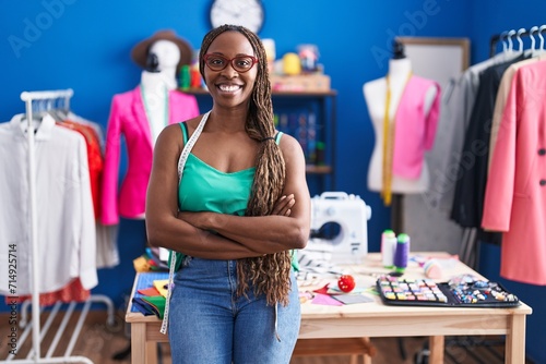 African american woman tailor smiling confident standing with arms crossed gesture at atelier