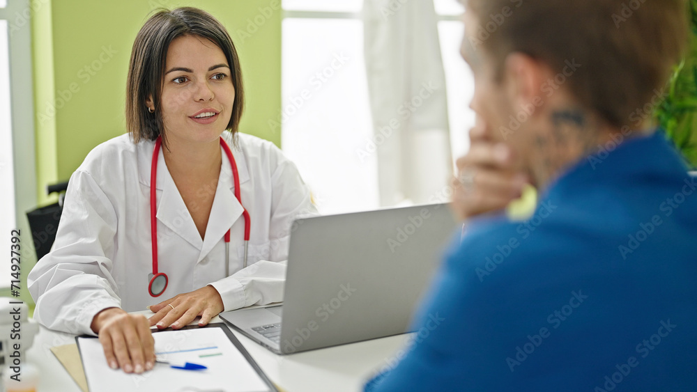 Doctor having medical consultation with patient at the clinic