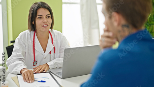 Doctor having medical consultation with patient at the clinic