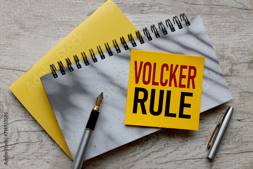 VOLCKER RULE pen points to text on sticker photo