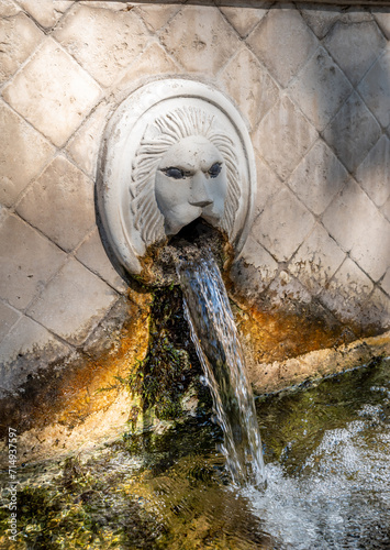 Old venetian fountain with lions heads in Spili, Crete island, Greece