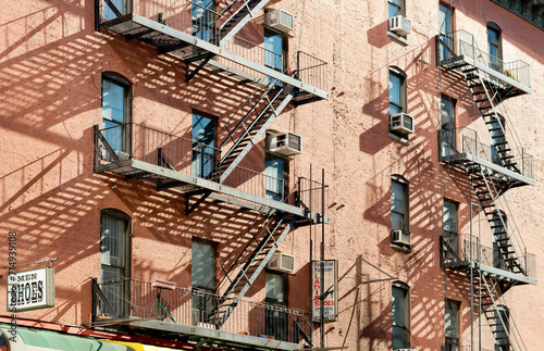  Exterior of a building with old fire escape in  New York City