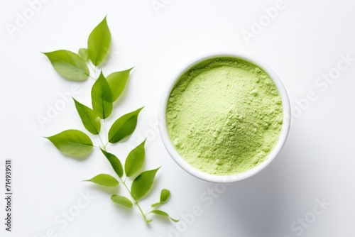 the matcha with green leaves on the white background 