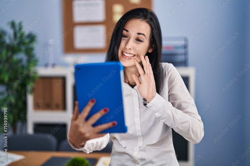 Young caucasian woman business worker smiling confident having video call at office Young caucasian woman business worker smiling confident having video call at office