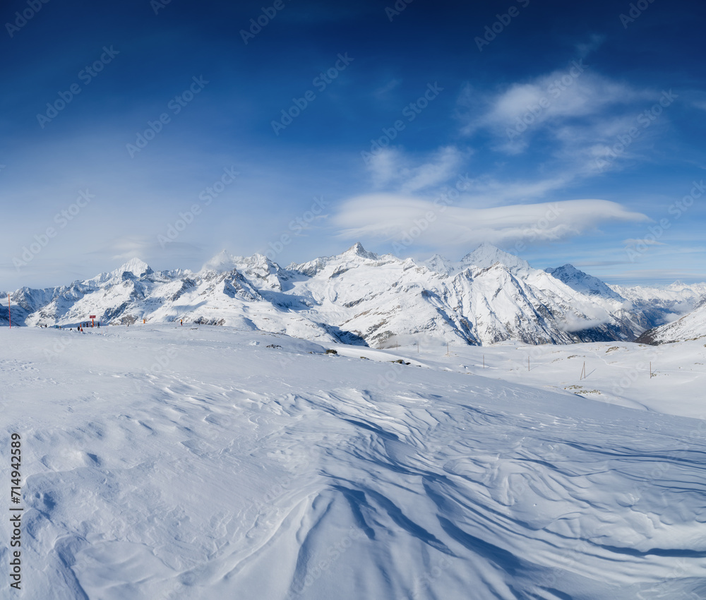 Winter mountain landscape. Wallpaper or background. Cold weather and frost. A place for skiing. Ski resort. High rocks and snow. View of mountains. Winter mountain landscape. Wallpaper or background. Cold weather and frost. A place for skiing. Ski resort. High rocks and snow. View of mountains.