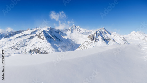 Winter mountain landscape. Wallpaper or background. Clear sky. Cold weather and frost. High rocks and snow. View of mountains.