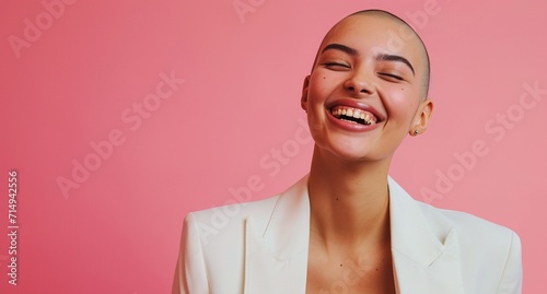 Fotografie, Obraz A woman with a shaved head smiling and laughing. Generative AI