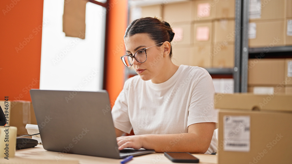 Young beautiful hispanic woman ecommerce business worker typing on computer at the office Young beautiful hispanic woman ecommerce business worker typing on computer at the office
