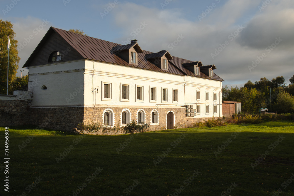 The carriage house at the historical estate. A historic building in the rays of the autumn sun. The carriage house at the historical estate. A historic building in the rays of the autumn sun.