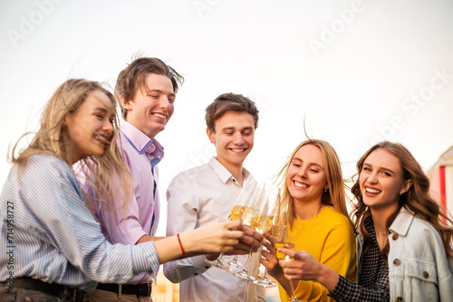 Cheerful friends drinking alcohol during banquet