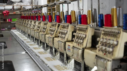 Cutting-edge world of garment manufacturing in Dhaka, Bangladesh, where advanced automatic sewing machines revolutionize the textile industry photo