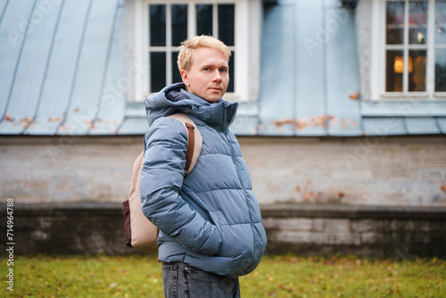 Portrait of a young man in a jacket in autumn