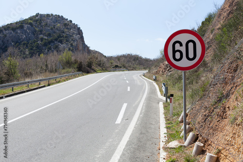 Road sign for the maximum speed limit photo