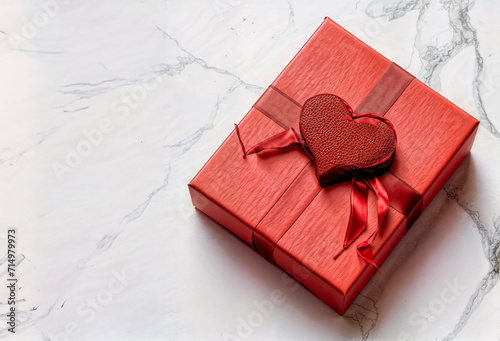 Red gift box adorned with a festive ribbon love celebration
