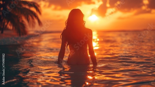 Silhouette of girl at beach dancing in water against sunrise background, beautiful sunrise color pallete, bokeh, palm trees © YamunaART
