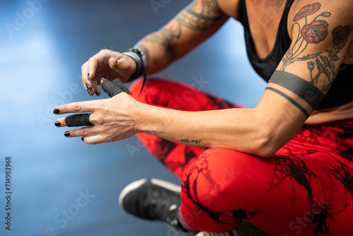 Close-up of athlete protecting her fingers with tape