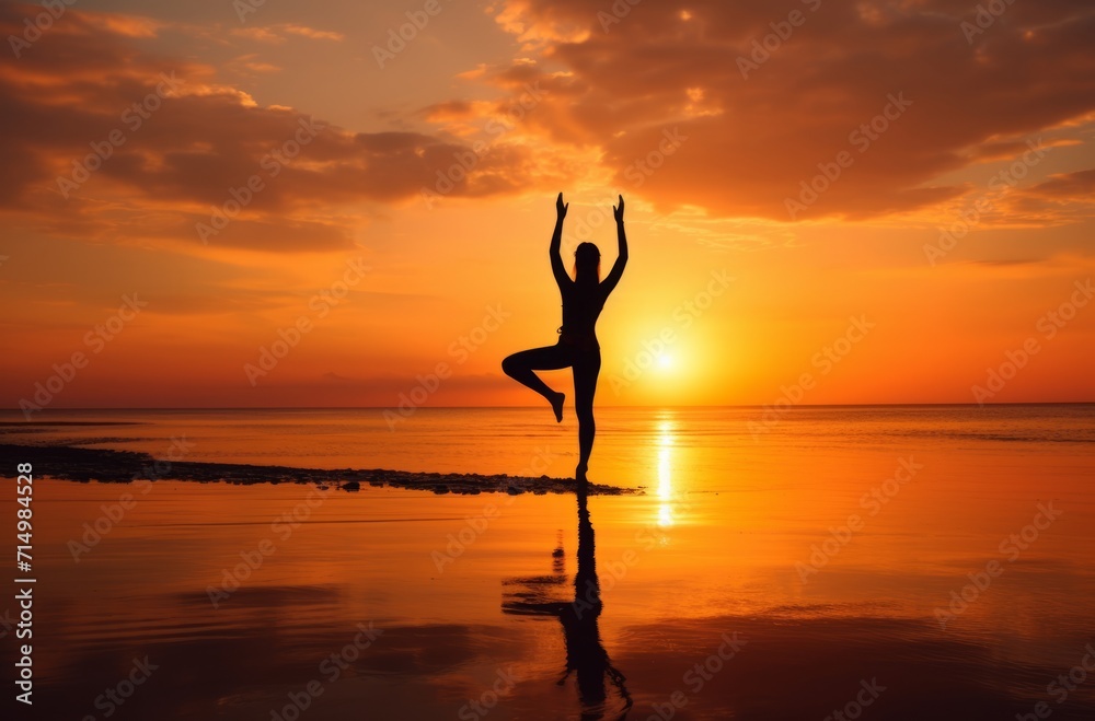 Silhouette of person practicing yoga on beach at sunset, conveying peace and harmony. Perfect for wellness themes.