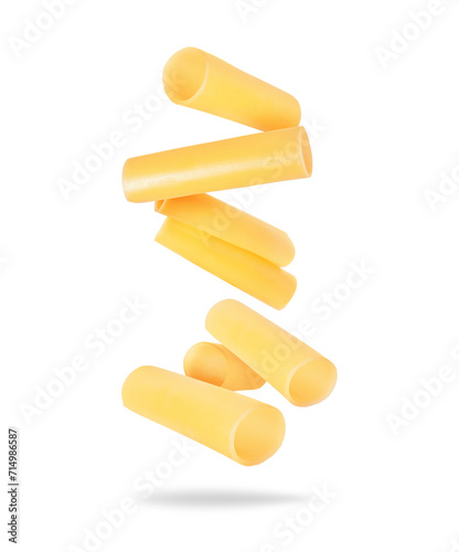 Levitation of italian cannelloni pasta tubes close up isolated on a white background photo