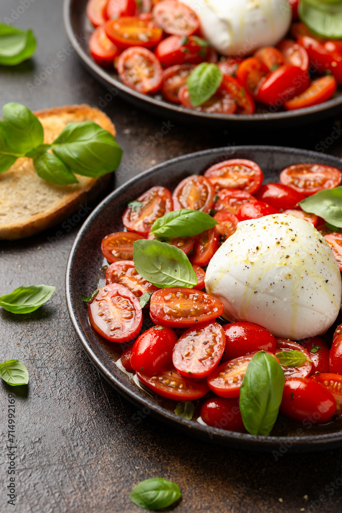 Tomato Burrata salad with herbs and basil. Healthy food Tomato Burrata salad with herbs and basil. Healthy food