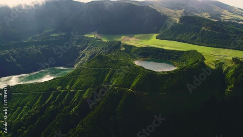 Aerial shot, drone point of view, Boca do Inferno. Picturesque lakes in volcanoes craters. San Miguel, Ponta Delgada island, Azores, Portugal. Bird eye view. Landmarks and natural wonders concept  photo