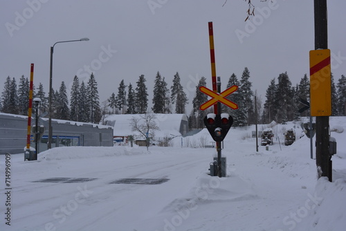 A small, cute winter town is Varkaus located in the province of North Savonia, Finland. Houses, roads, buildings, structures, trees, forests, fir trees, spruces covered with snow. photo