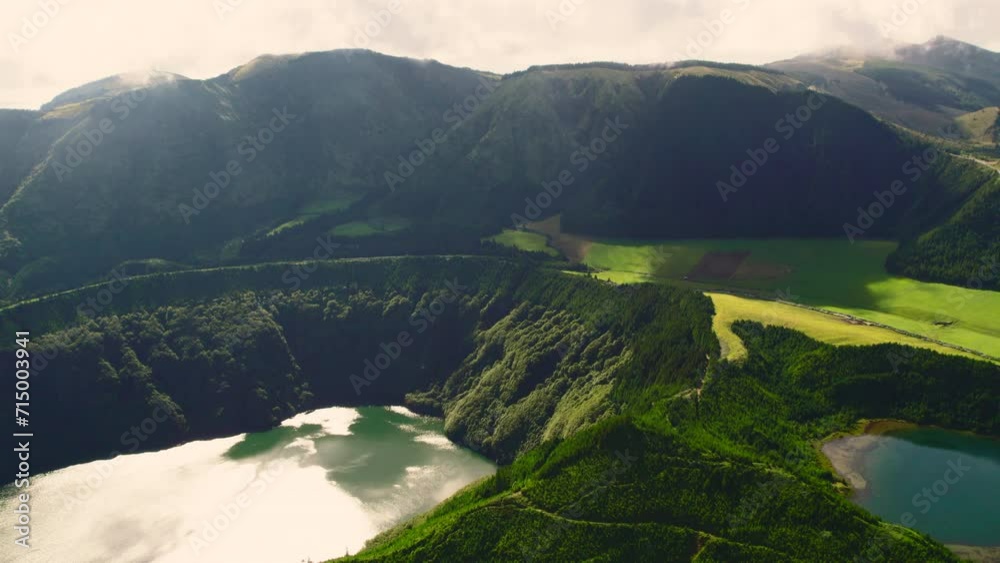 Aerial shot, drone point of view, Boca do Inferno. Picturesque lakes in volcanoes craters. San Miguel, Ponta Delgada island, Azores, Portugal. Bird eye view. Landmarks and natural wonders concept Aerial shot, drone point of view, Boca do Inferno. Picturesque lakes in volcanoes craters. San Miguel, Ponta Delgada island, Azores, Portugal. Bird eye view. Landmarks and natural wonders concept