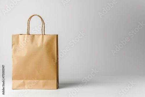 A paper grocery bag on a light gray background, with an empty space photo