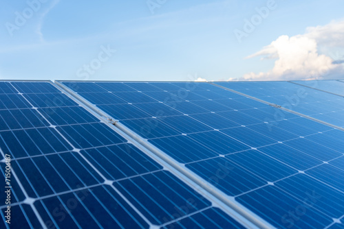 close up on solar panels with blue sky background