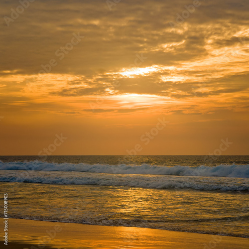 Tropical beach  sea and bright sunset.