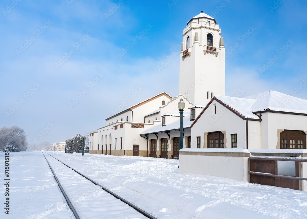 Train depot in winter with fresh cut tracks in the snow