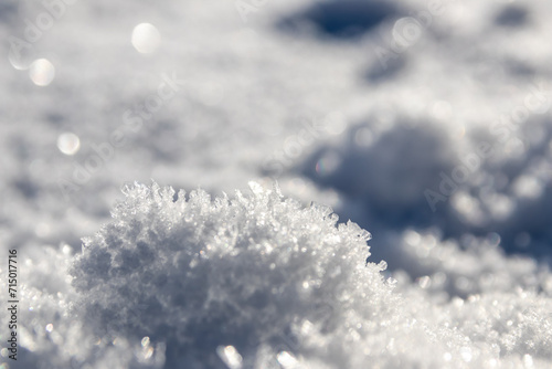 Ice crystals macro in close-up view shows beautiful ice structures of frozen water with spikey crystals and elegant snowflakes after winter snowfall in arctic climate with cold temperatures crackling
