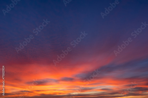 Fototapeta Naklejka Na Ścianę i Meble -  Dramatic orange sunset sky background overlay. Ideal for sky replacement