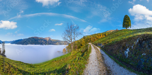 Peaceful misty autumn morning mountain view from hiking path from Dorfgastein to Paarseen lakes, Land Salzburg, Austria.