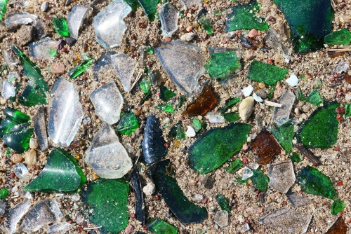 Colorful shards of broken glass lying on the ground.