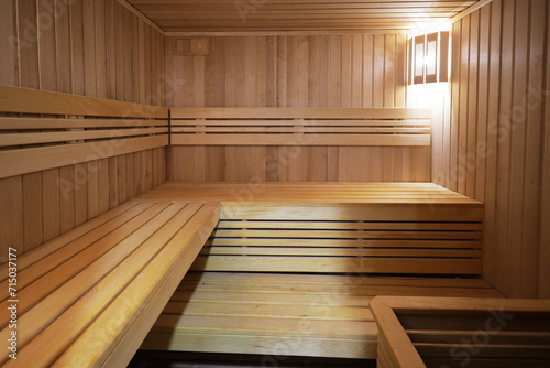 Interior of Finnish sauna, classic wooden sauna with hot steam. Russian bathroom.