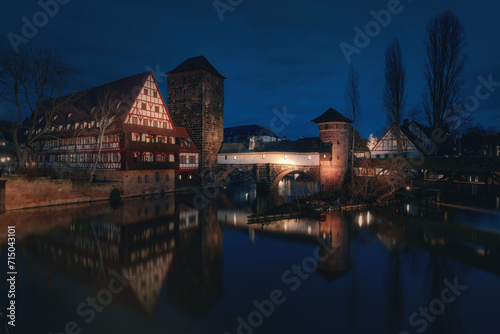 Night view of bridge and beautiful old buildings on the Pegnitz River in Nuremberg. Bavaria Region Middle Franconia, Germany