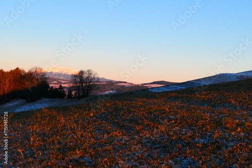 die Felder der buckligen Welt am Morgen mit Blick auf den Schneeberg photo