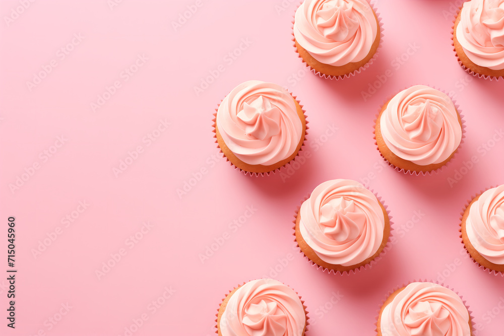 Flatlay with pink cupcakes on a pink background. Festive image for bakery's advertisement or children's birthday party service. Design for a cafe or dessert shop. Banner with copy space
