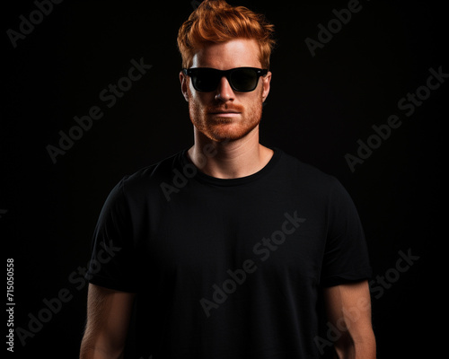 Handsome ginger man isolated on black background © ovid