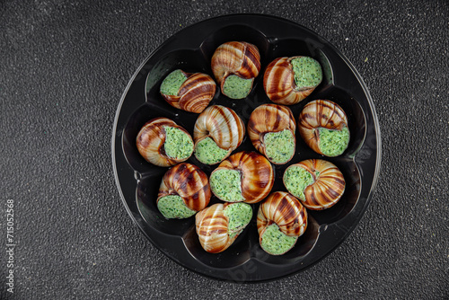 snails with green oil aromatic herbs tasty fresh healthy eating cooking appetizer meal food snack on the table copy space food background