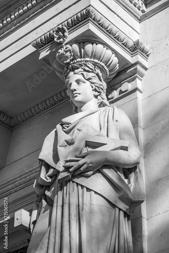 Detail of one of the statues flanking the entrance to the Ministry of Agriculture in Madrid. Black and white.