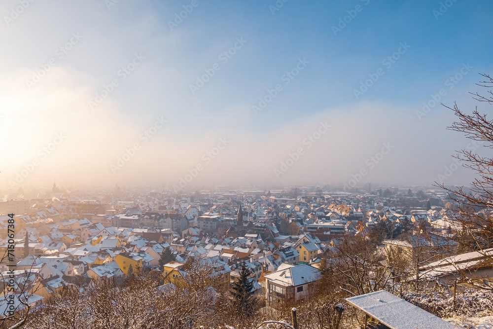 winter in the city with warm sun and snow near Marburg