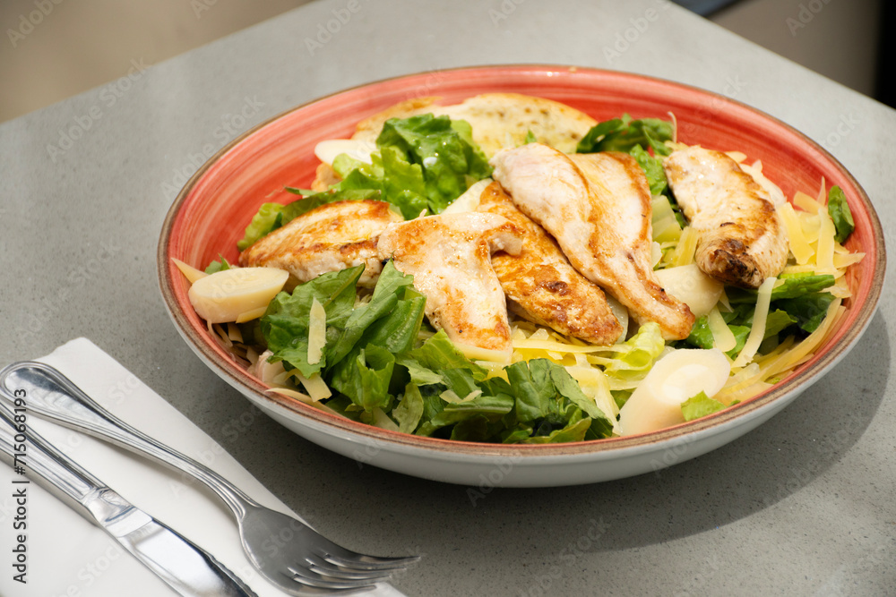 salad plate with healthy grilled chicken breast in restaurant salad plate with healthy grilled chicken breast in restaurant